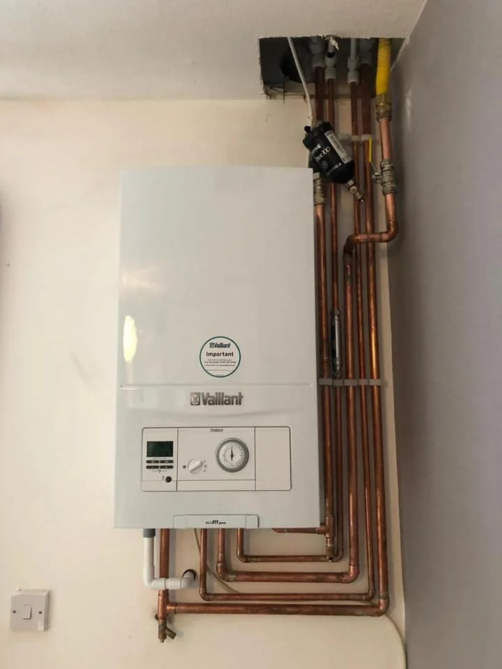 New Vaillant gas boiler installation with copper piping, showcasing energy-efficient heating solution for homes in Brentwood.