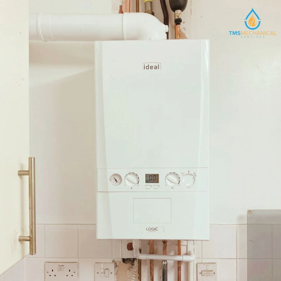 Ideal Logic boiler installed on a wall, showcasing controls and display, representing T.M.S. Mechanical Services' heating solutions in Dagenham.