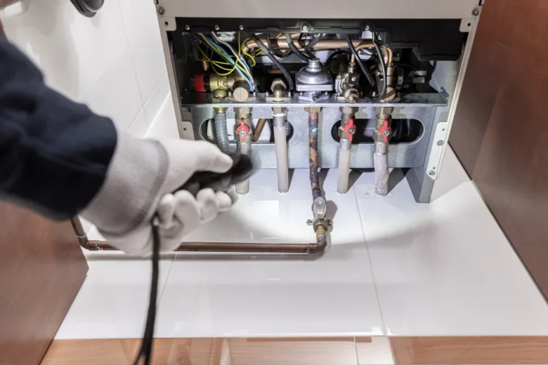Technician-inspecting-a-gas-heater-or-heating-boiler-in-a-house-2