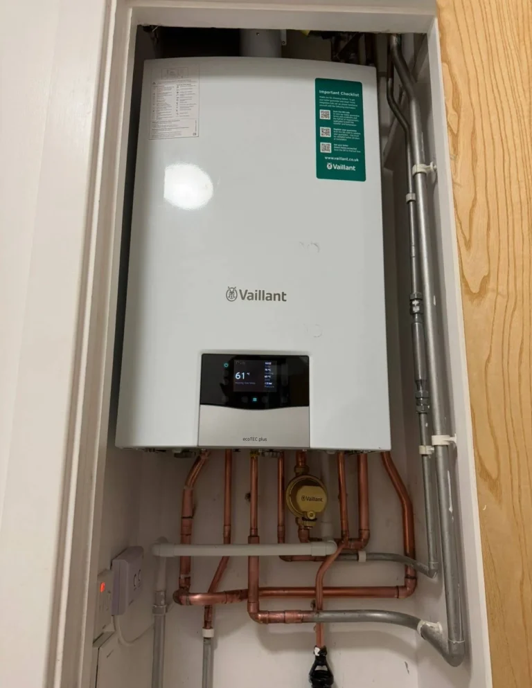 Vaillant ecoTEC plus boiler installed with copper piping and digital display, illustrating modern heating solutions for improved energy efficiency and reliability in homes.